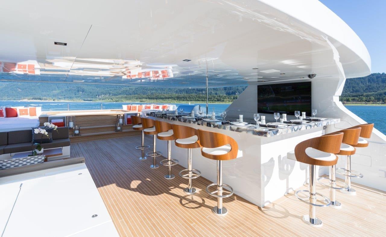 a room with stools and tables aboard CHASSEUR Yacht for Charter