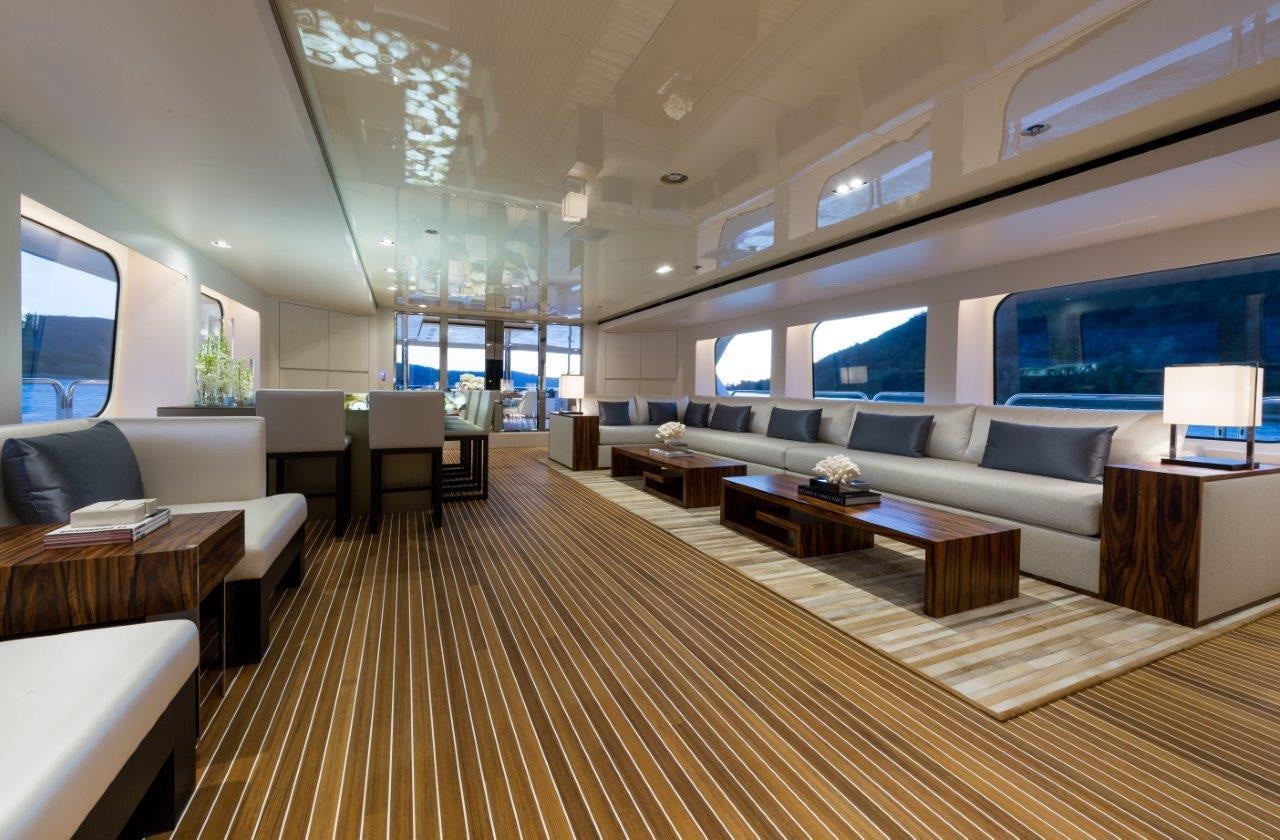 a large living room with a large wood floor aboard CHASSEUR Yacht for Charter