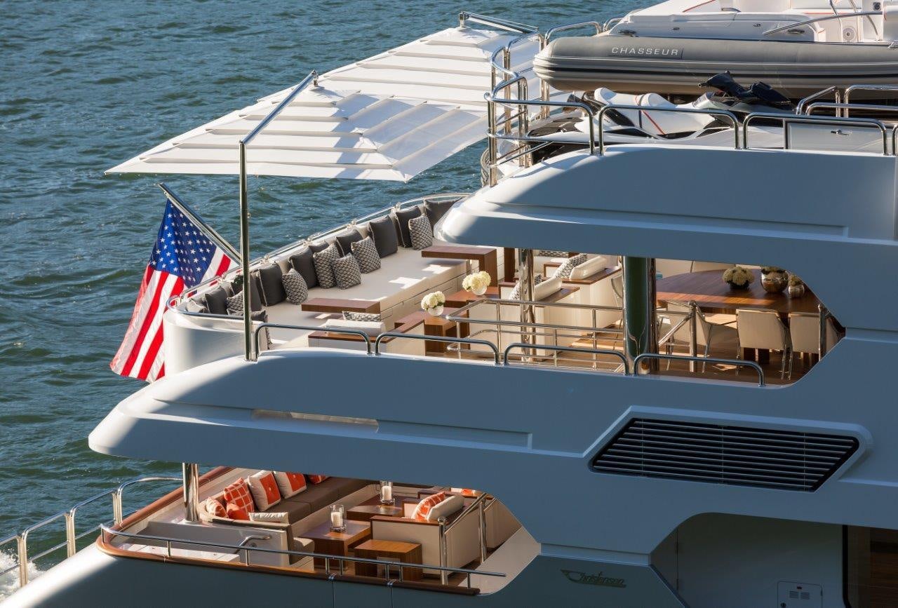 a boat with a flag on the front aboard CHASSEUR Yacht for Charter