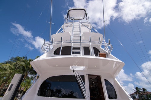 a white boat with a ladder on the front aboard CABALLO GRANDE Yacht for Sale