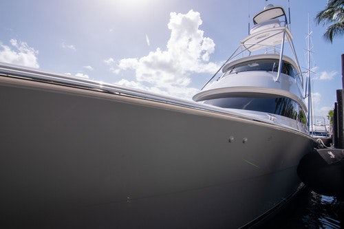a white boat on a dock aboard CABALLO GRANDE Yacht for Sale