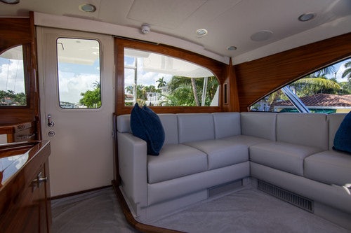 a white couch in a room aboard CABALLO GRANDE Yacht for Sale
