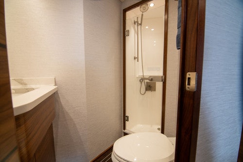 a bathroom with a toilet and sink aboard CABALLO GRANDE Yacht for Sale