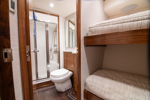 a bathroom with a glass shower door aboard CABALLO GRANDE Yacht for Sale