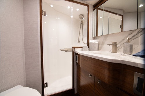 a bathroom with a white door aboard CABALLO GRANDE Yacht for Sale