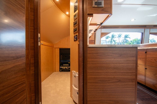 a room with wooden cabinets aboard CABALLO GRANDE Yacht for Sale