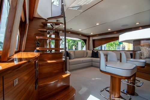 a living room with a wood floor aboard CABALLO GRANDE Yacht for Sale