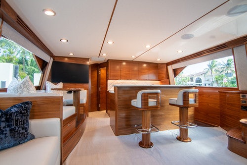 a room with a table and chairs aboard CABALLO GRANDE Yacht for Sale