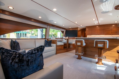 a living room with a couch and a coffee table aboard CABALLO GRANDE Yacht for Sale