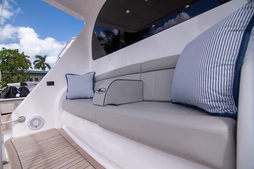 a white car with a white roof aboard CABALLO GRANDE Yacht for Sale
