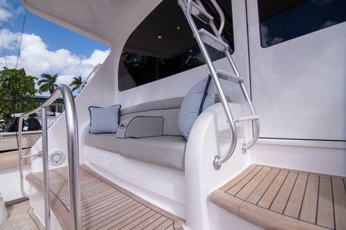 a white car with a large open door aboard CABALLO GRANDE Yacht for Sale
