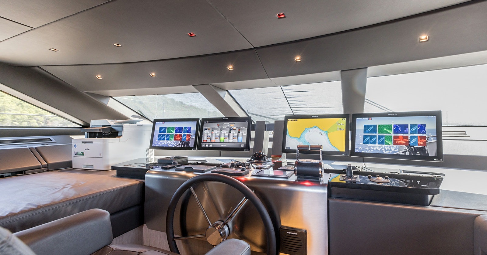 a room with several screens aboard JICJ Yacht for Sale