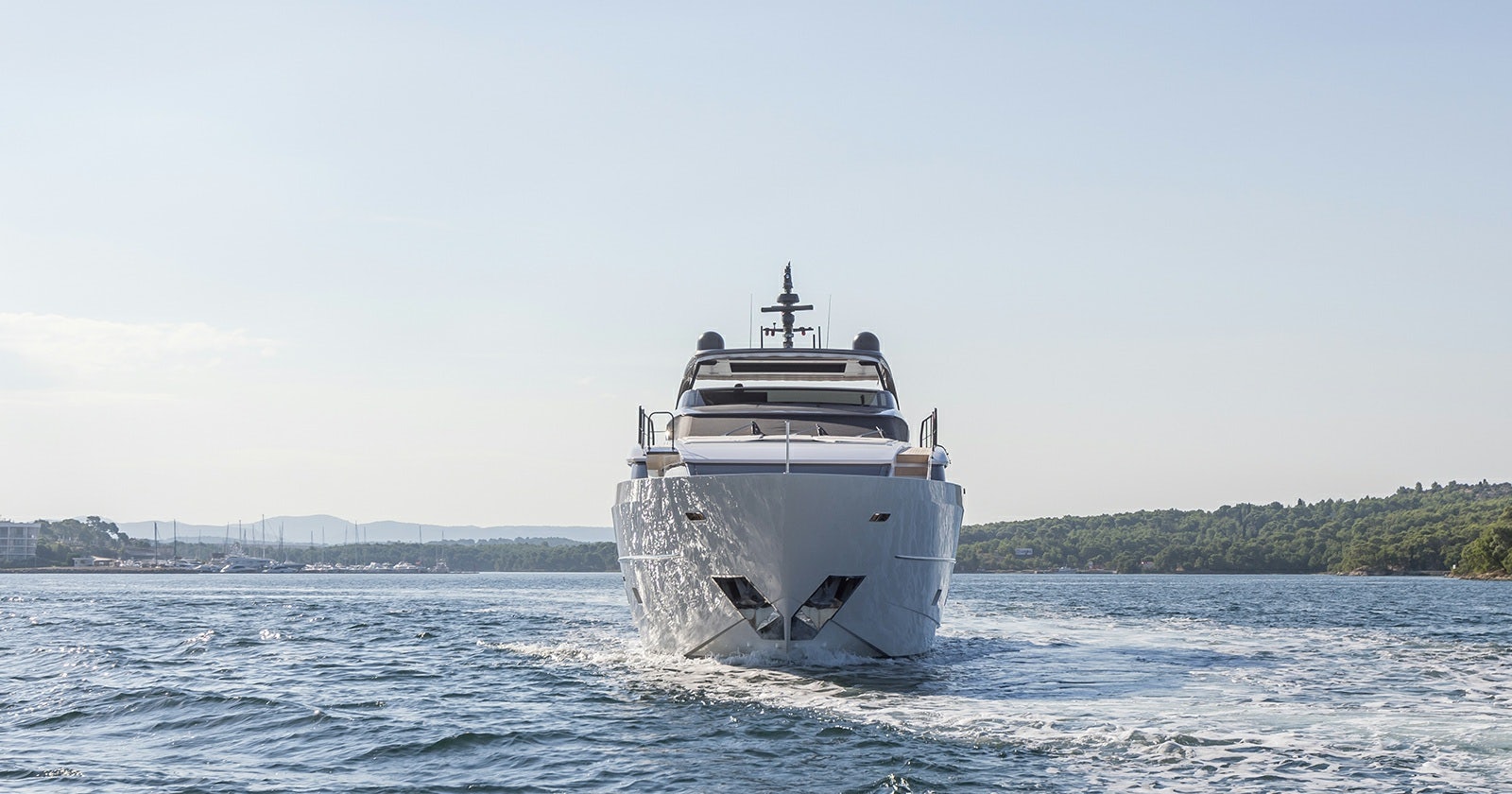 a large white ship in the water aboard JICJ Yacht for Sale