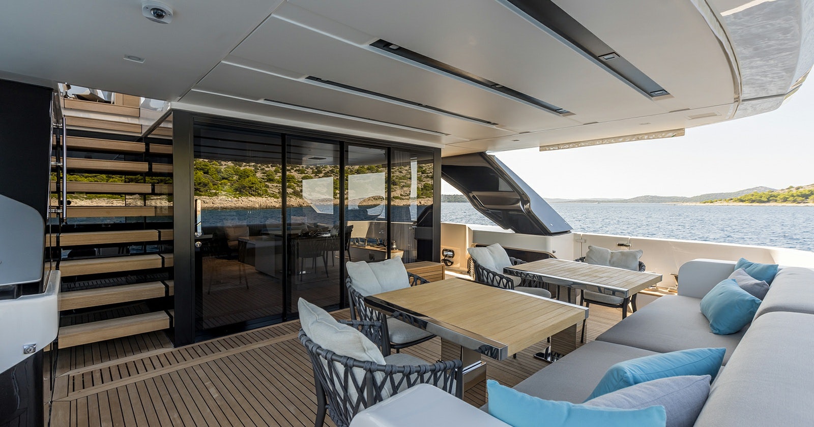 a room with a table and chairs aboard JICJ Yacht for Sale