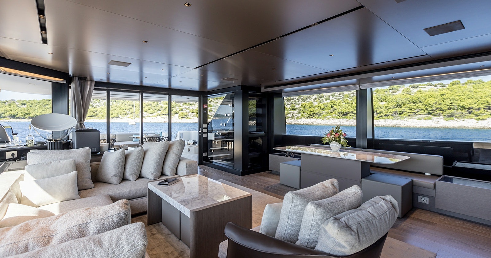 a living room with a large window aboard JICJ Yacht for Sale