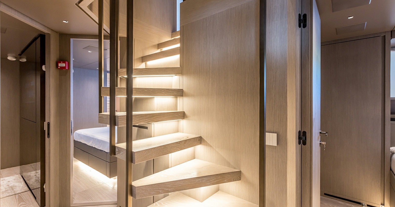 a room with a staircase and a glass door aboard JICJ Yacht for Sale