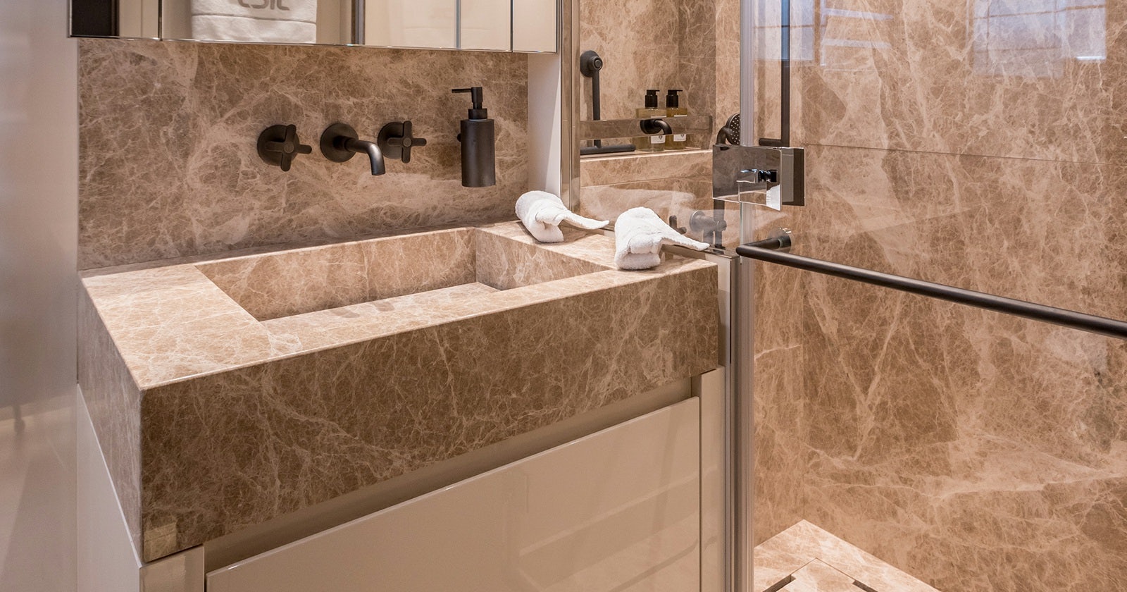a bathroom with a marble counter top aboard JICJ Yacht for Sale