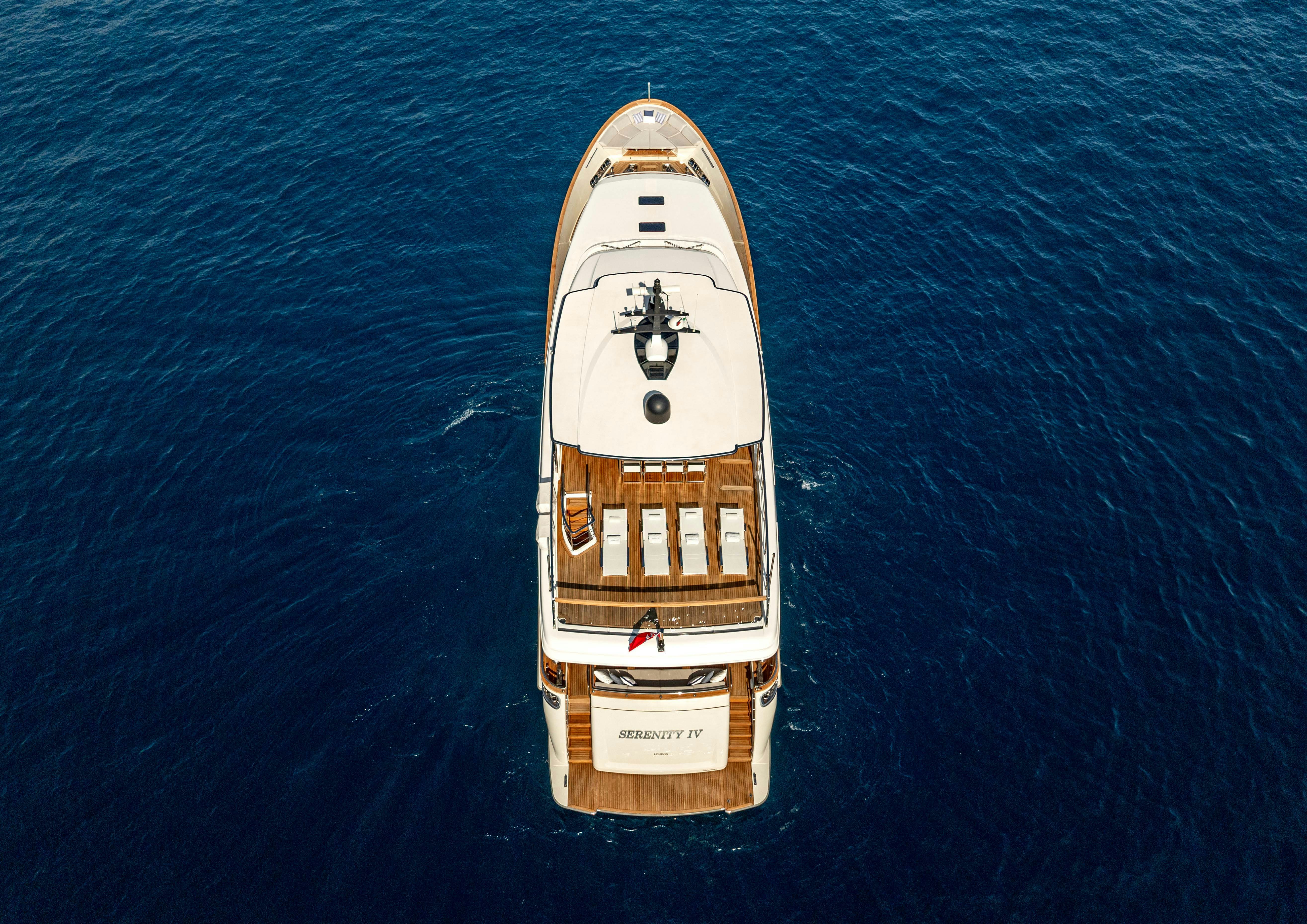 a small wooden boat aboard SERENITY IV Yacht for Sale