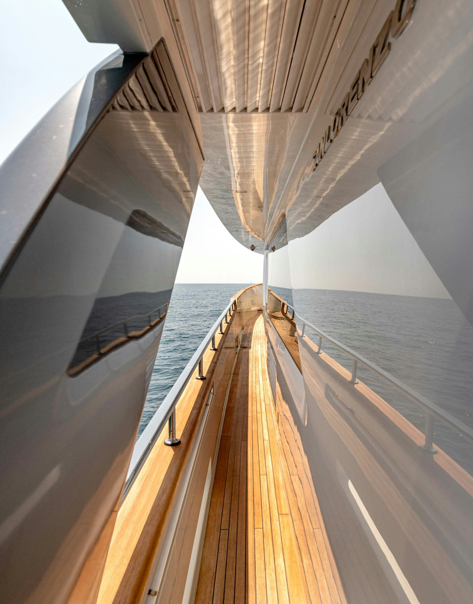 a wooden boat on a body of water aboard SERENITY IV Yacht for Sale