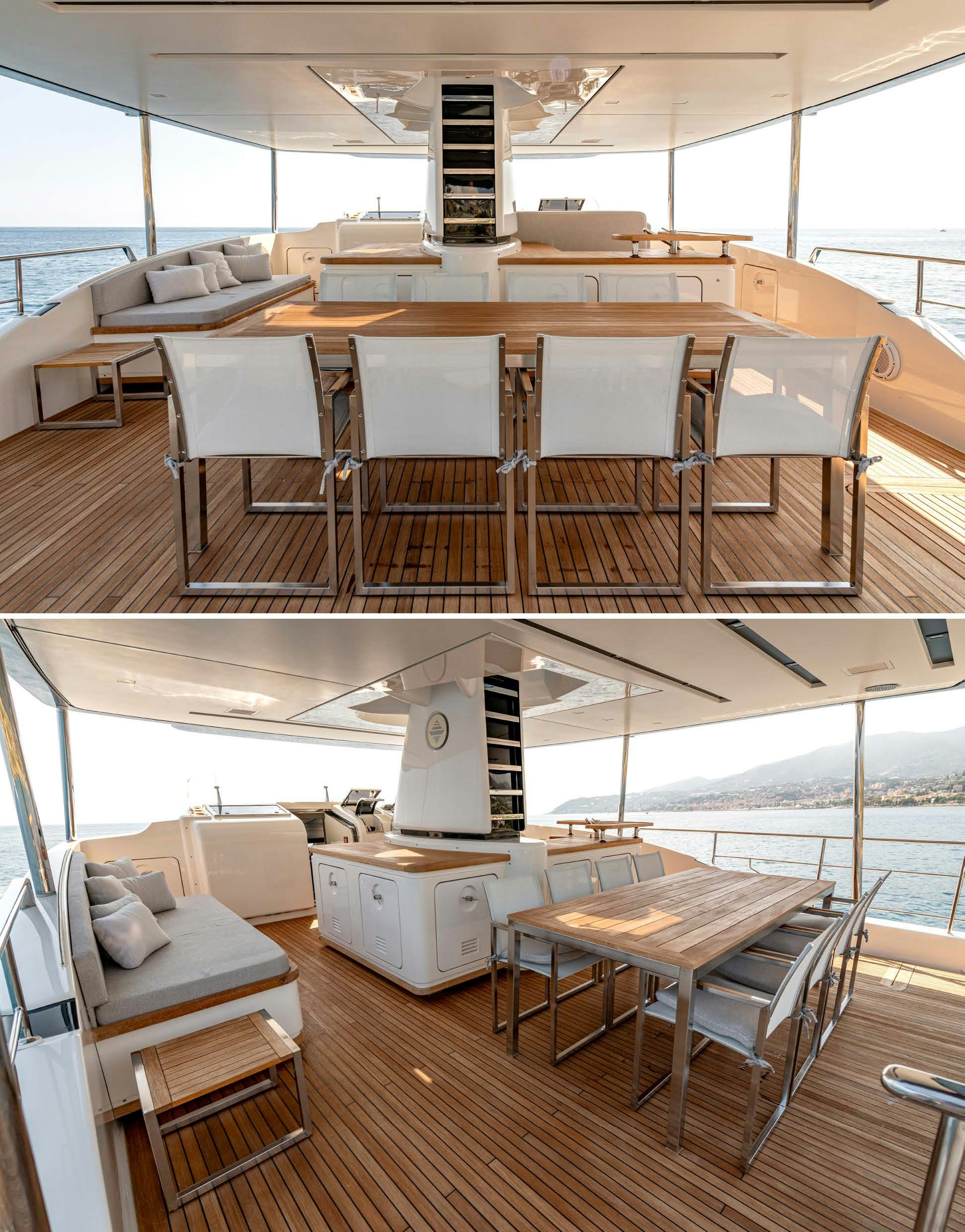 a large boat with a table and chairs aboard SERENITY IV Yacht for Sale