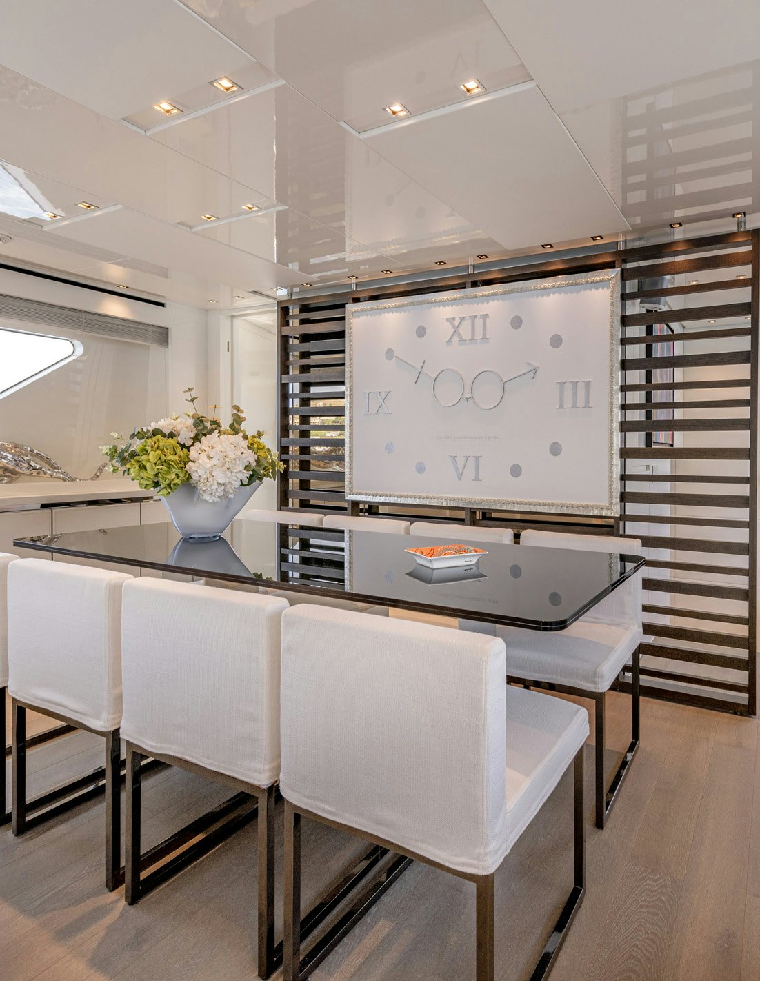 a large white board with a table and chairs in a room with a large white wall aboard SERENITY IV Yacht for Sale