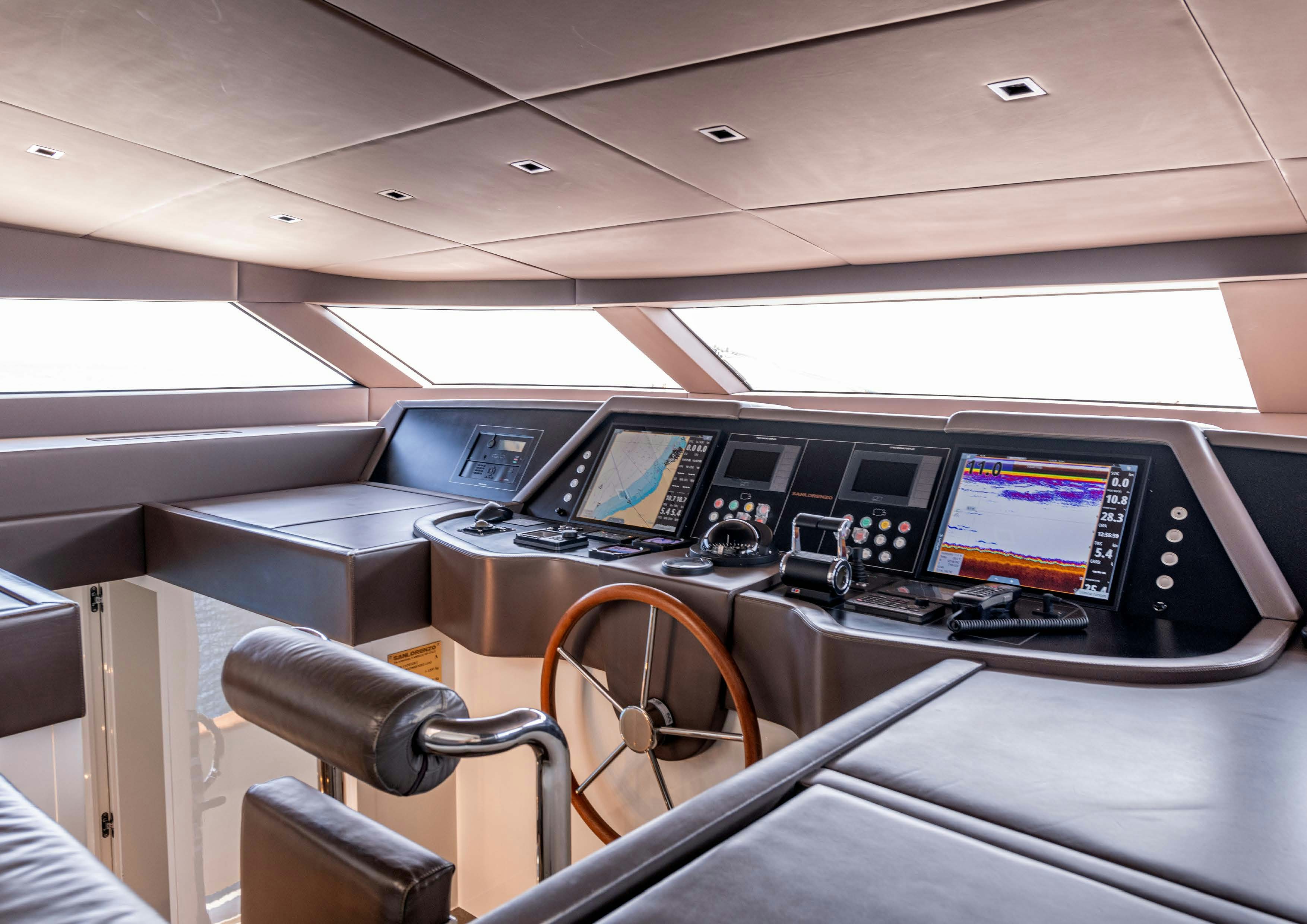 inside of a vehicle with a computer and monitor aboard SERENITY IV Yacht for Sale
