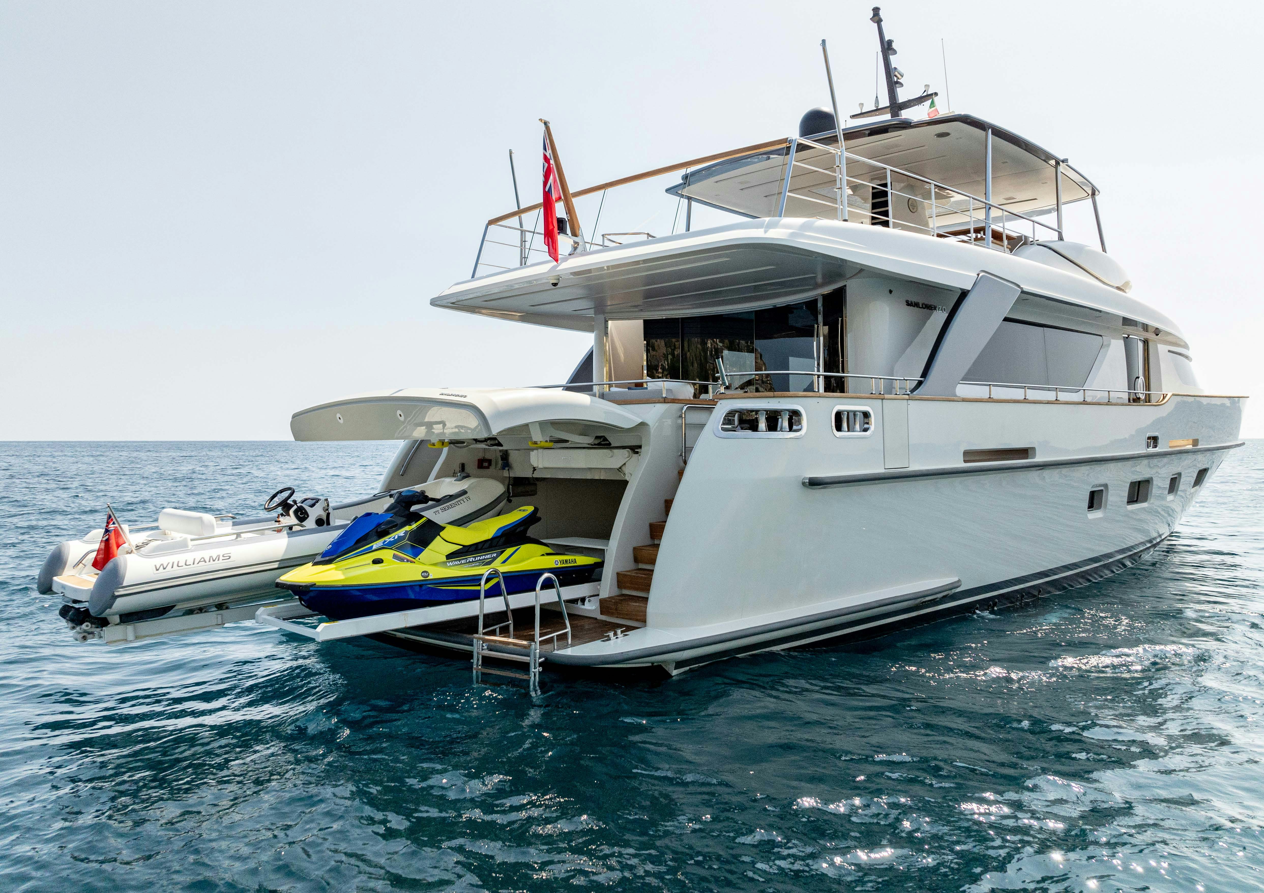 a boat with a boat on the water aboard SERENITY IV Yacht for Sale