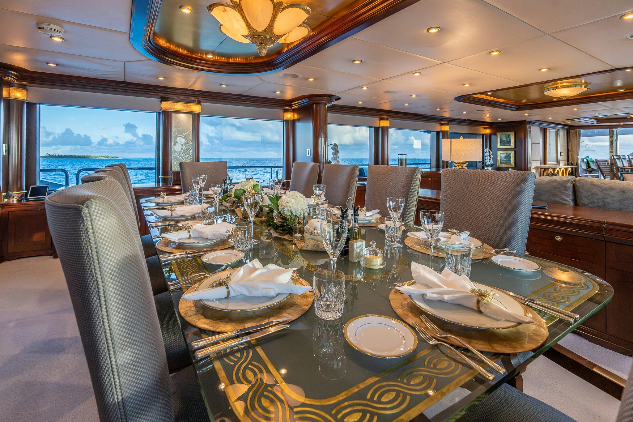 a dining room with a table set aboard ZOOM ZOOM ZOOM Yacht for Charter
