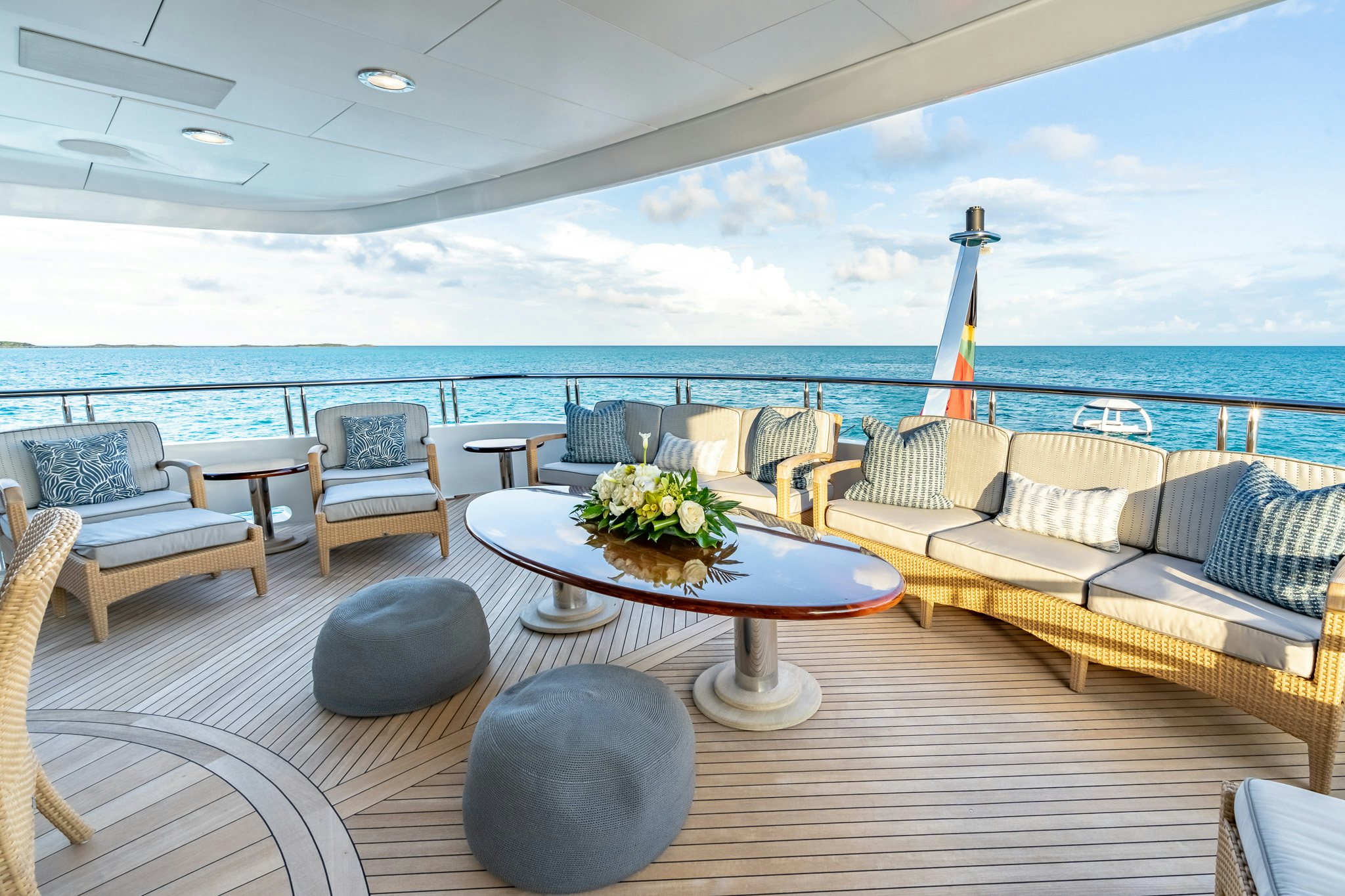 a large living room with a large balcony overlooking the ocean aboard ZOOM ZOOM ZOOM Yacht for Charter