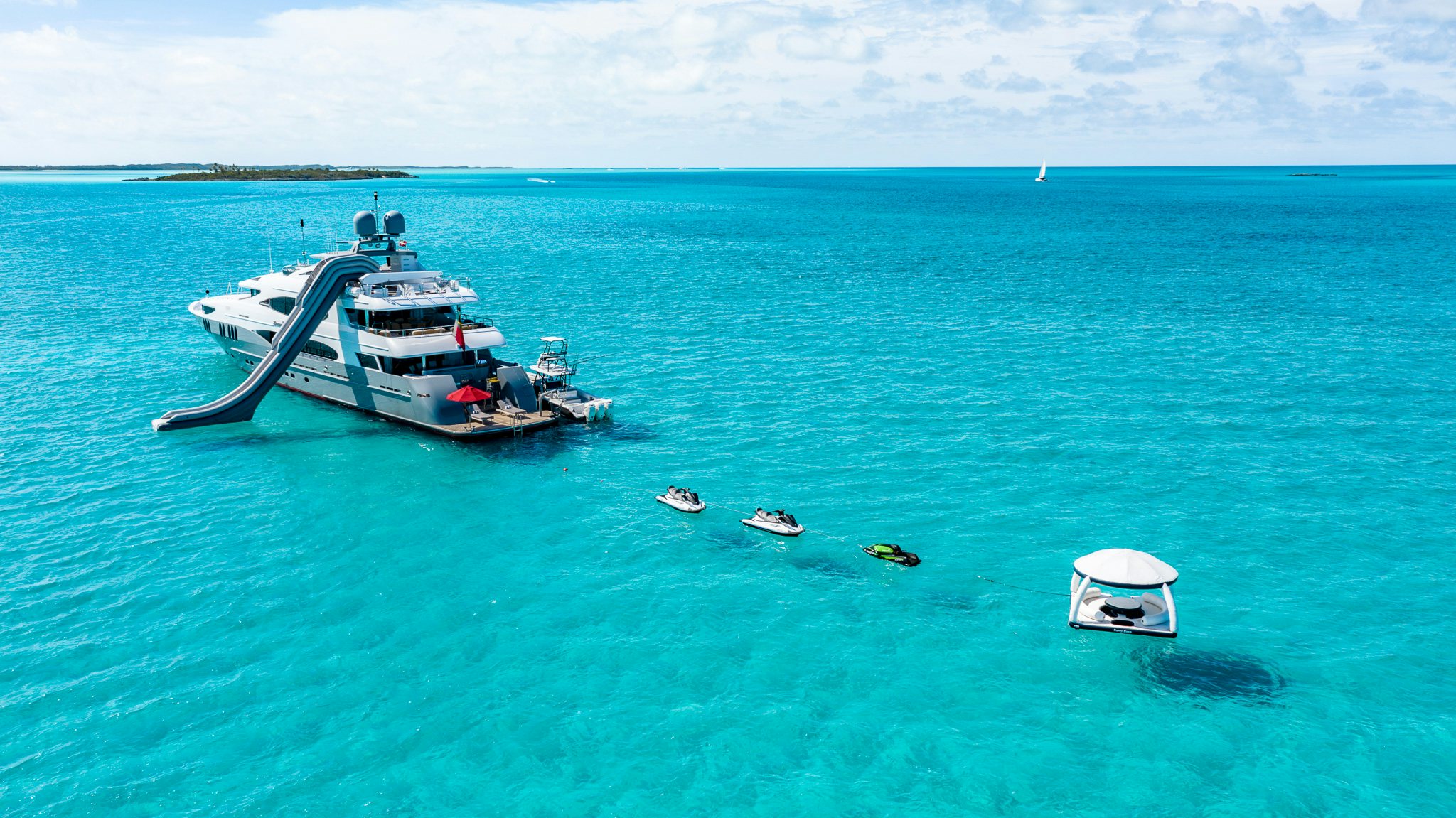 a boat and a couple of boats in the water aboard ZOOM ZOOM ZOOM Yacht for Charter