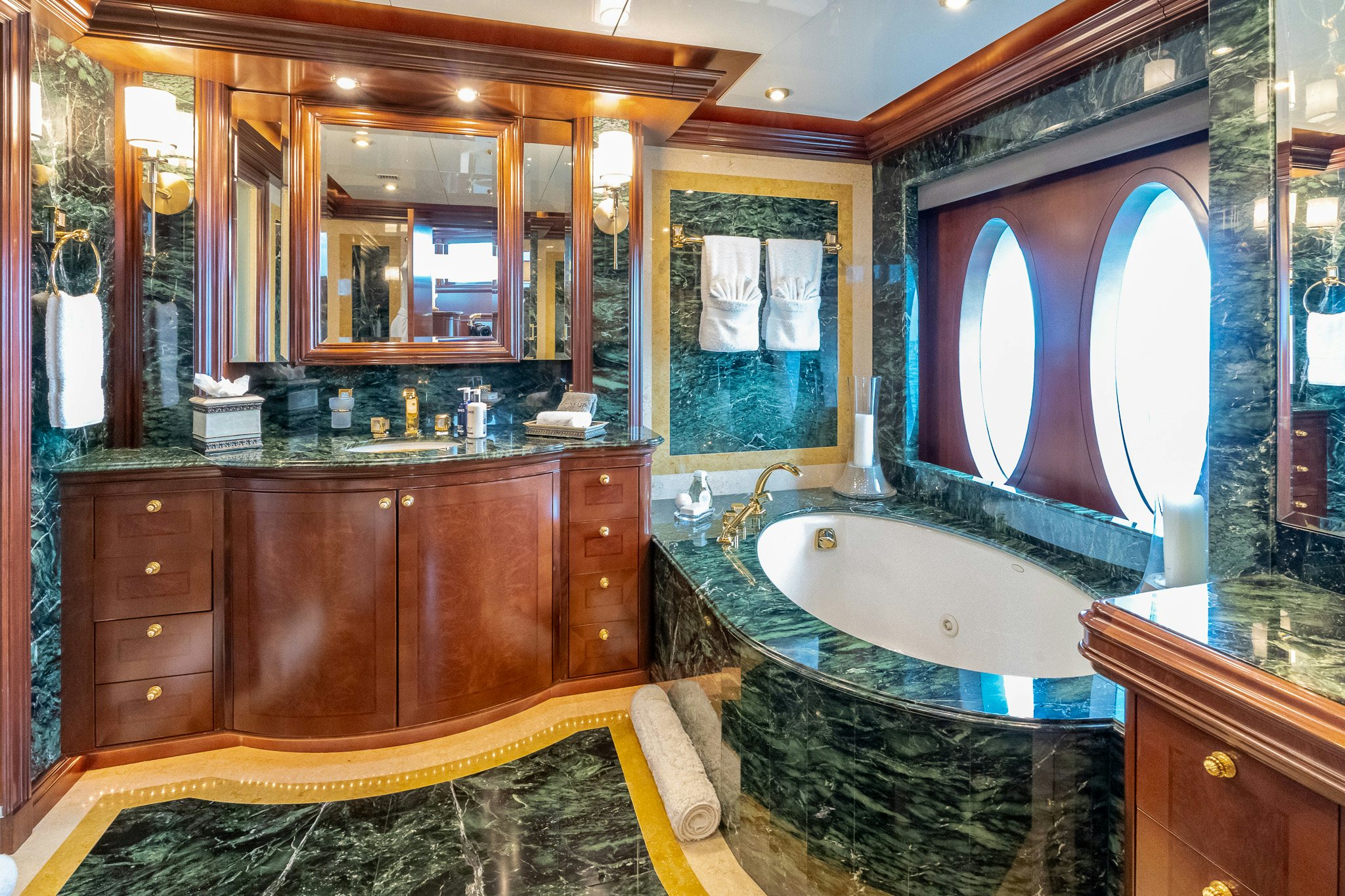 a bathroom with a tub and a sink aboard ZOOM ZOOM ZOOM Yacht for Charter