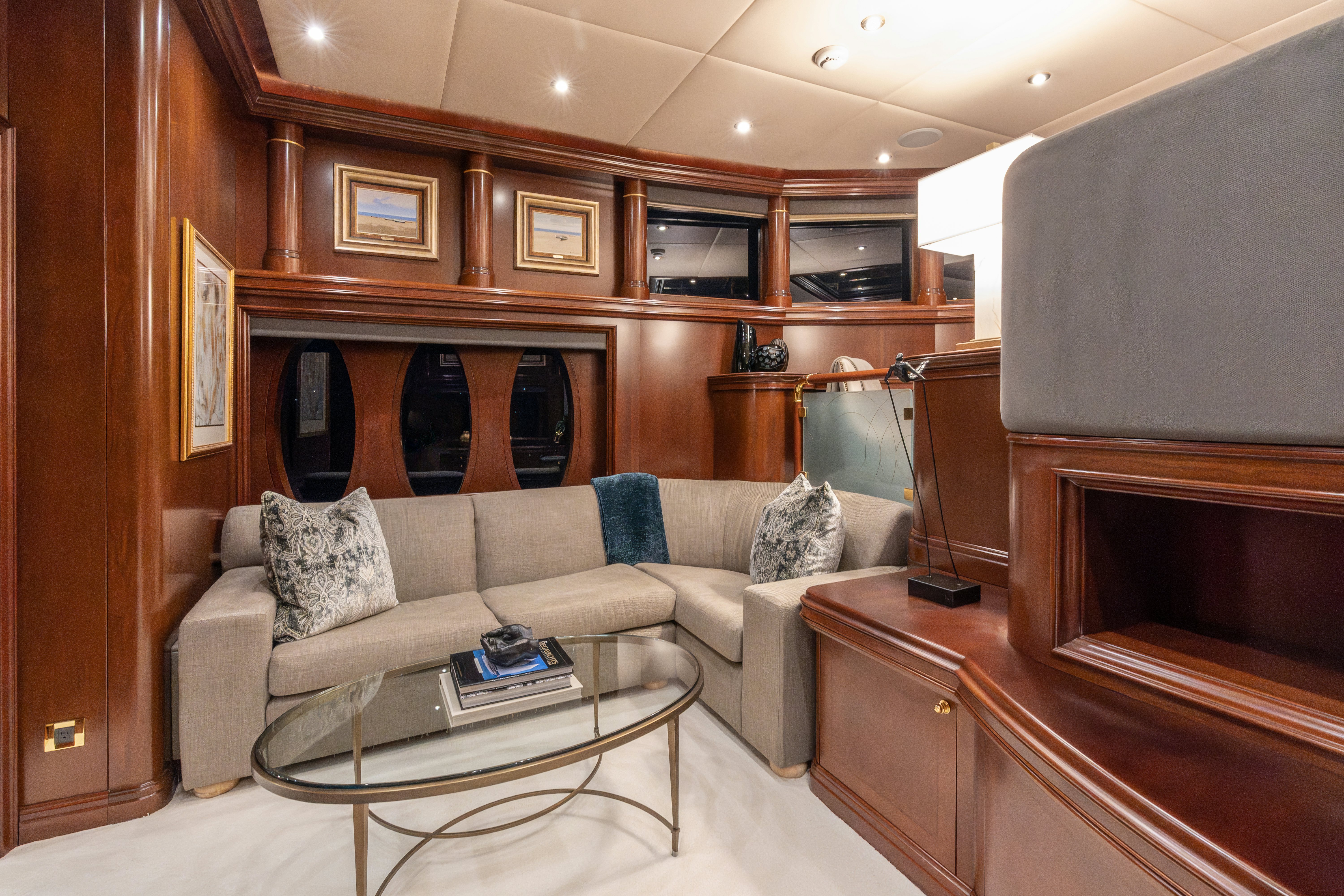 a living room with a couch and a coffee table aboard ZOOM ZOOM ZOOM Yacht for Charter