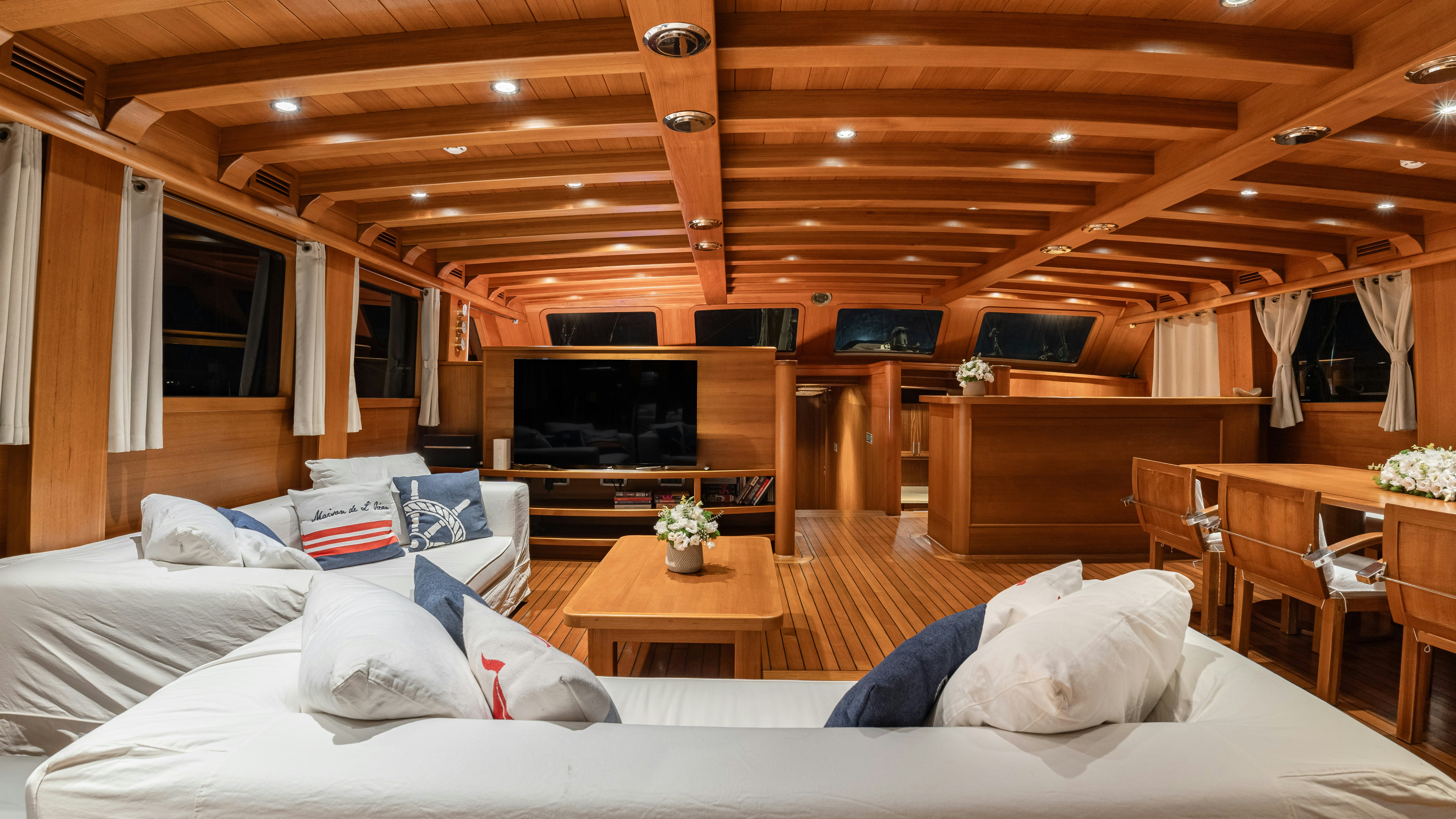 a room with a couch and a television aboard CAKIRYILDIZ Yacht for Sale
