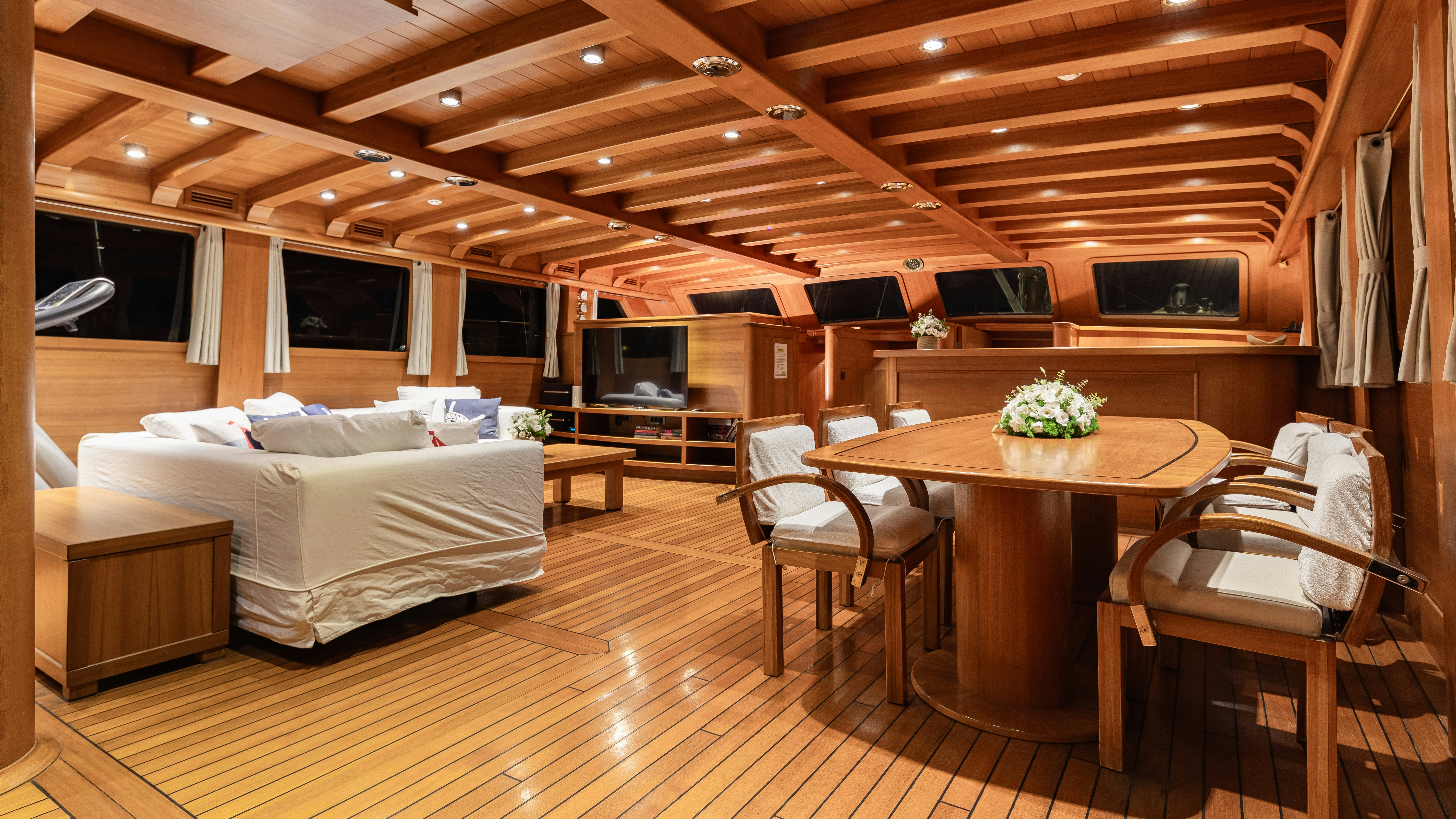 a room with a bed and a table aboard CAKIRYILDIZ Yacht for Sale