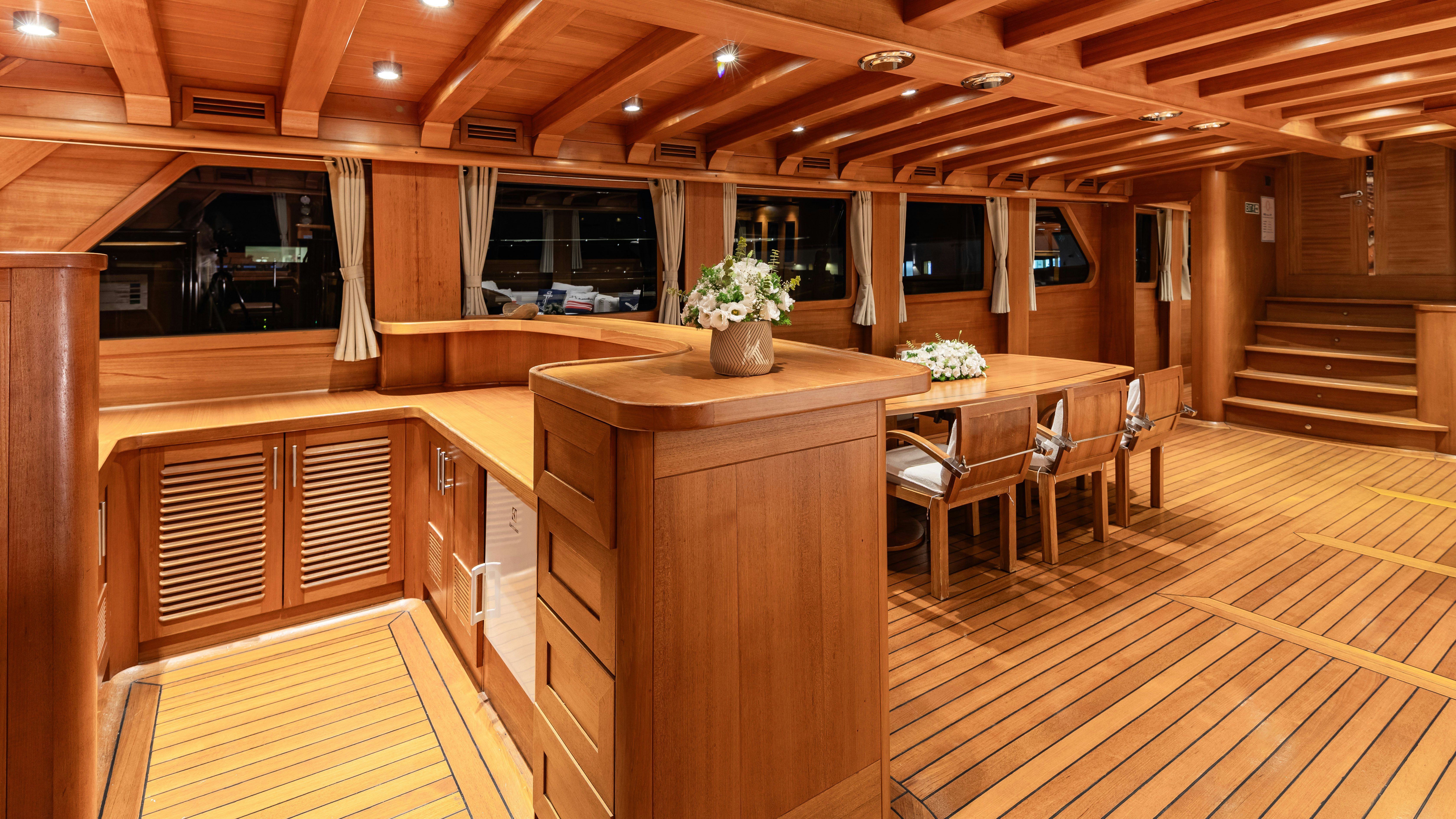 a kitchen with wooden cabinets aboard CAKIRYILDIZ Yacht for Sale