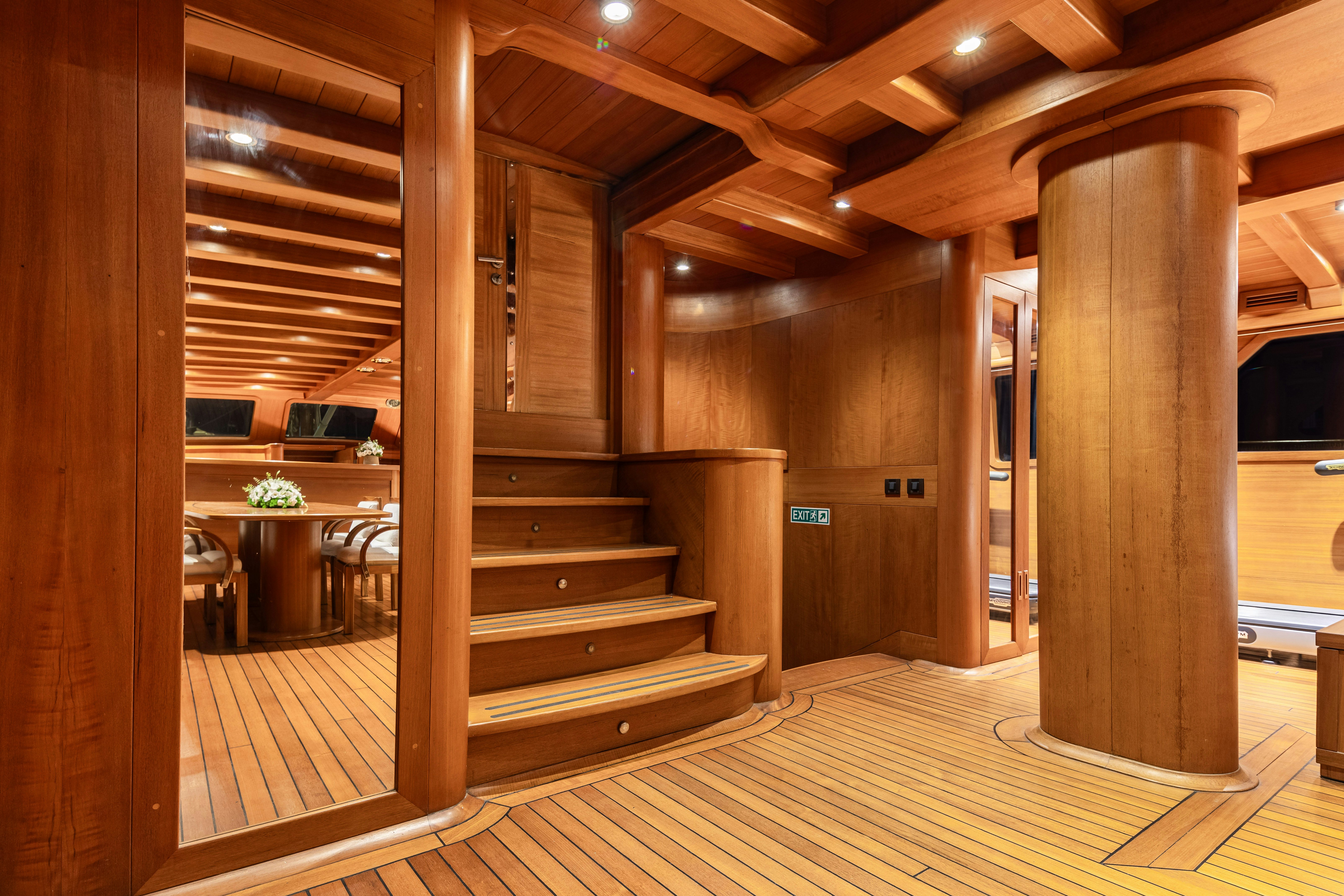 a wooden staircase in a building aboard CAKIRYILDIZ Yacht for Sale