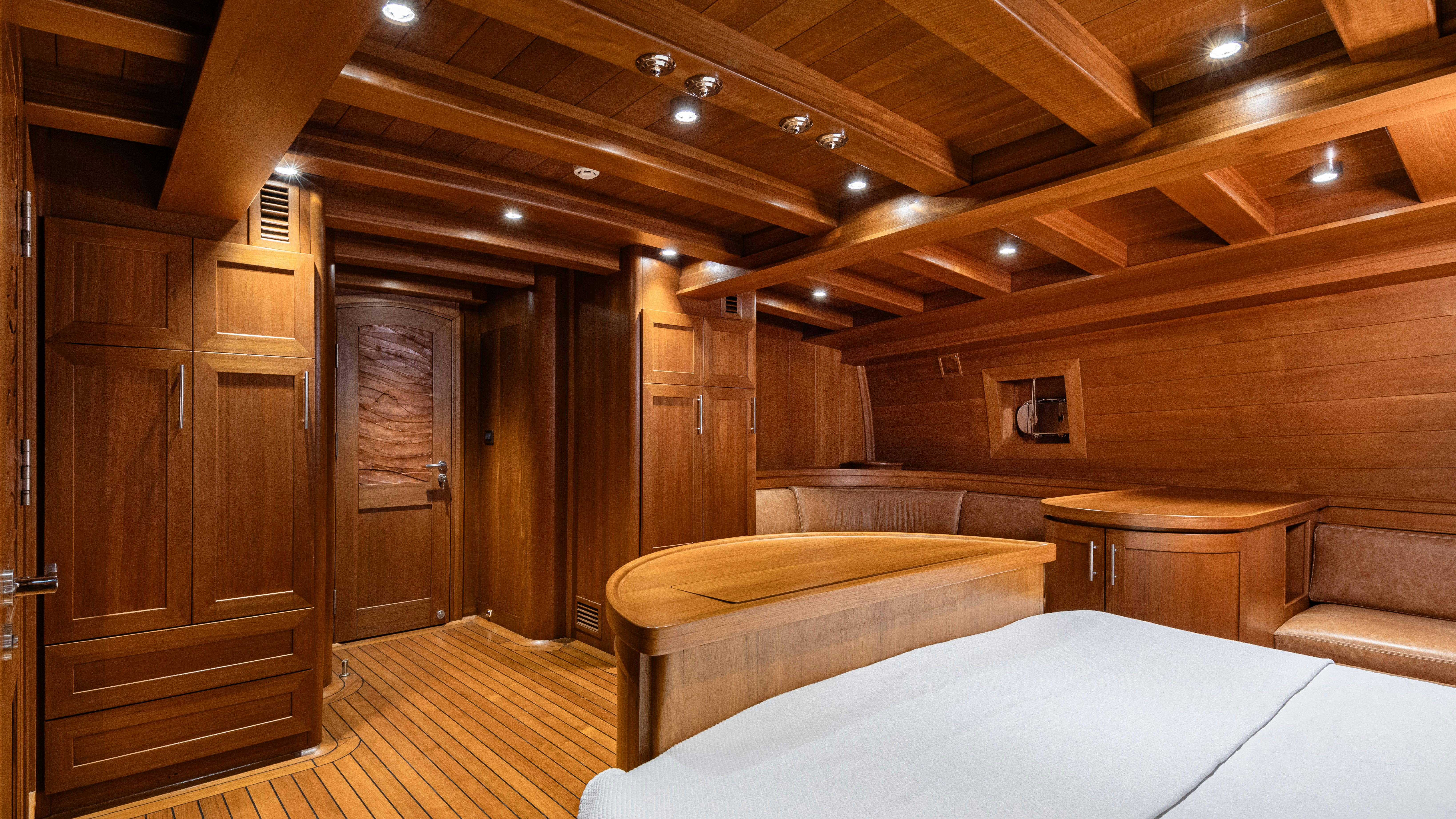 a room with a bed and a table aboard CAKIRYILDIZ Yacht for Sale