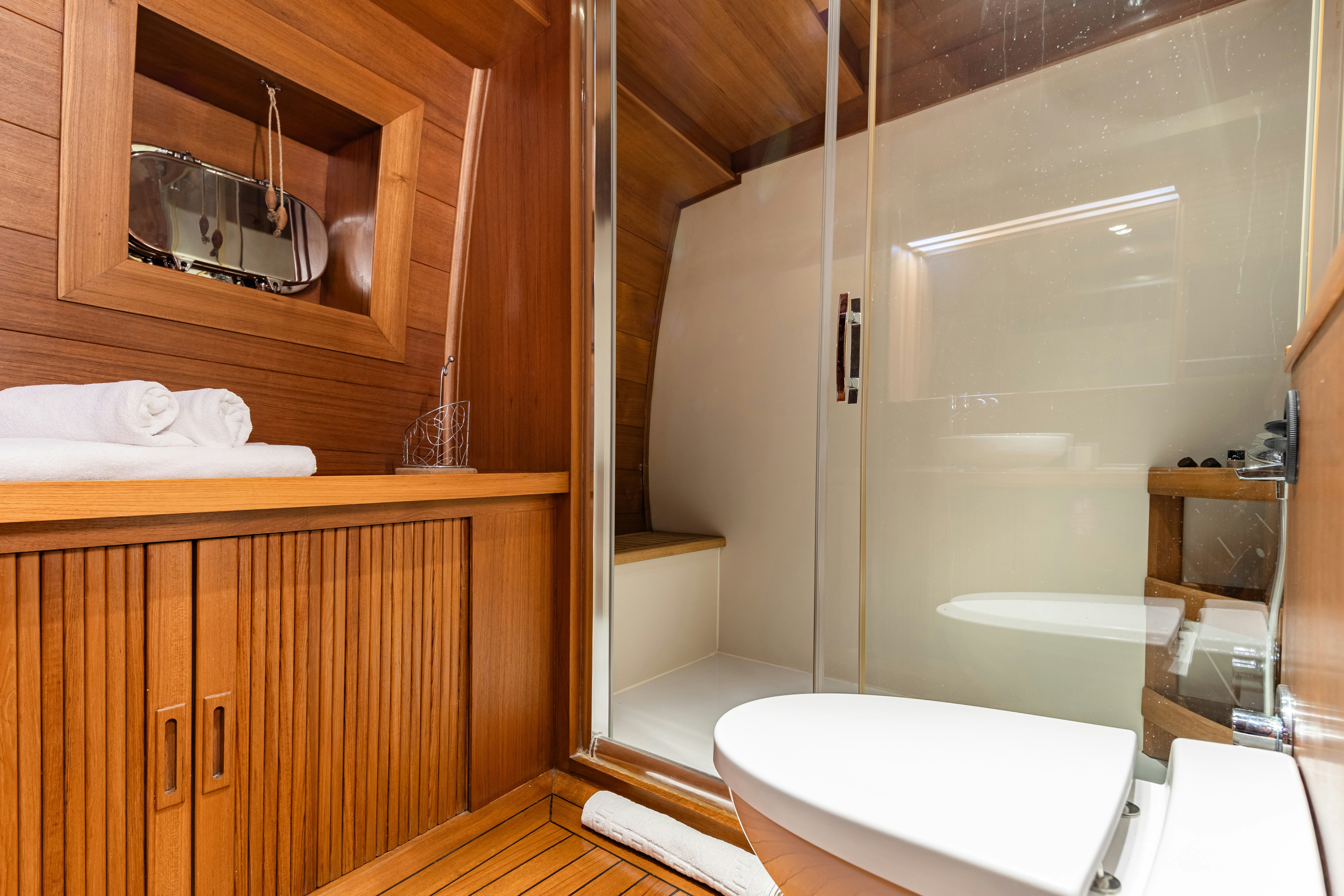 a bathroom with a shower and sink aboard CAKIRYILDIZ Yacht for Sale