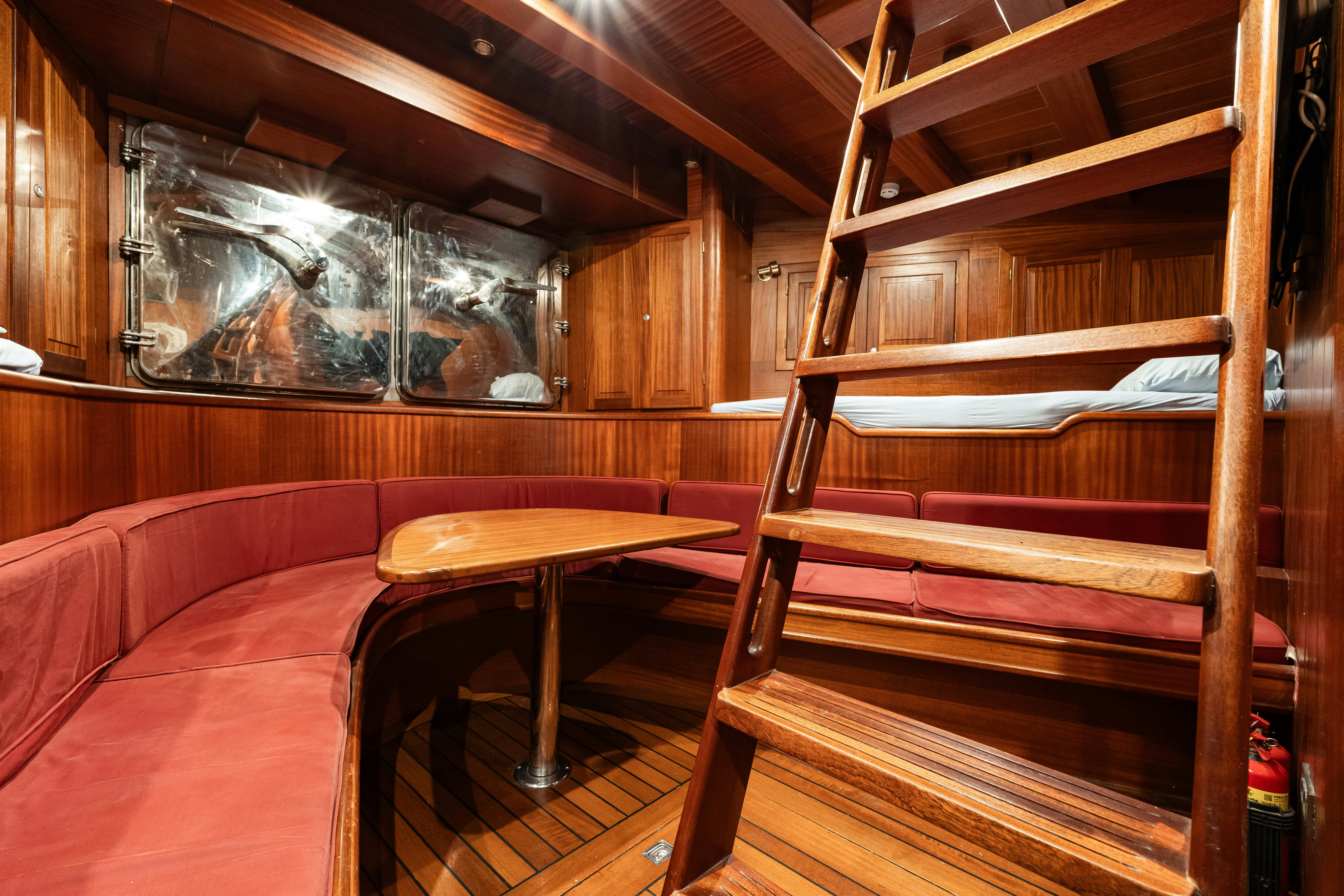 a room with a table and chairs aboard CAKIRYILDIZ Yacht for Sale
