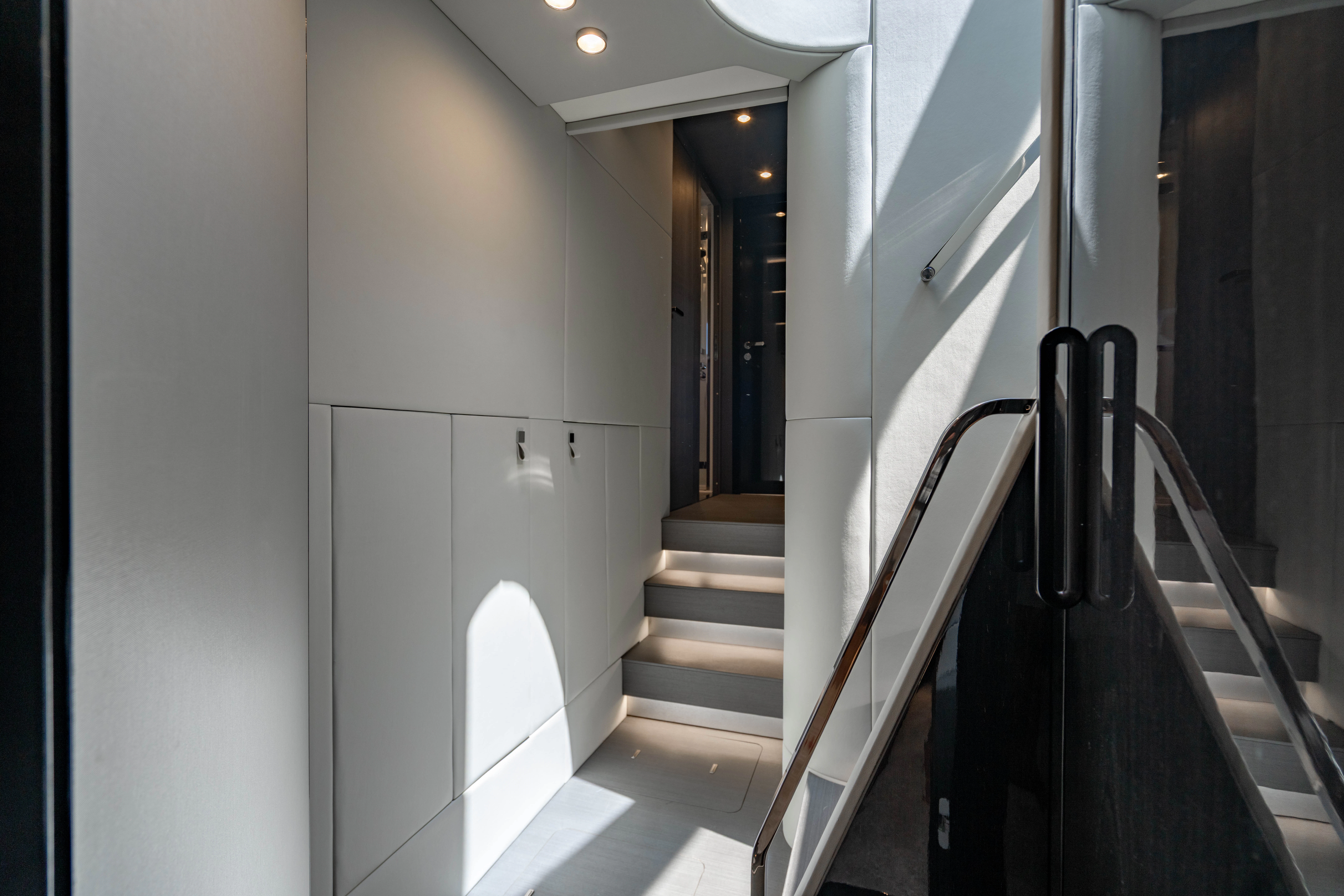 a hallway with white walls aboard ESCAPIST Yacht for Sale