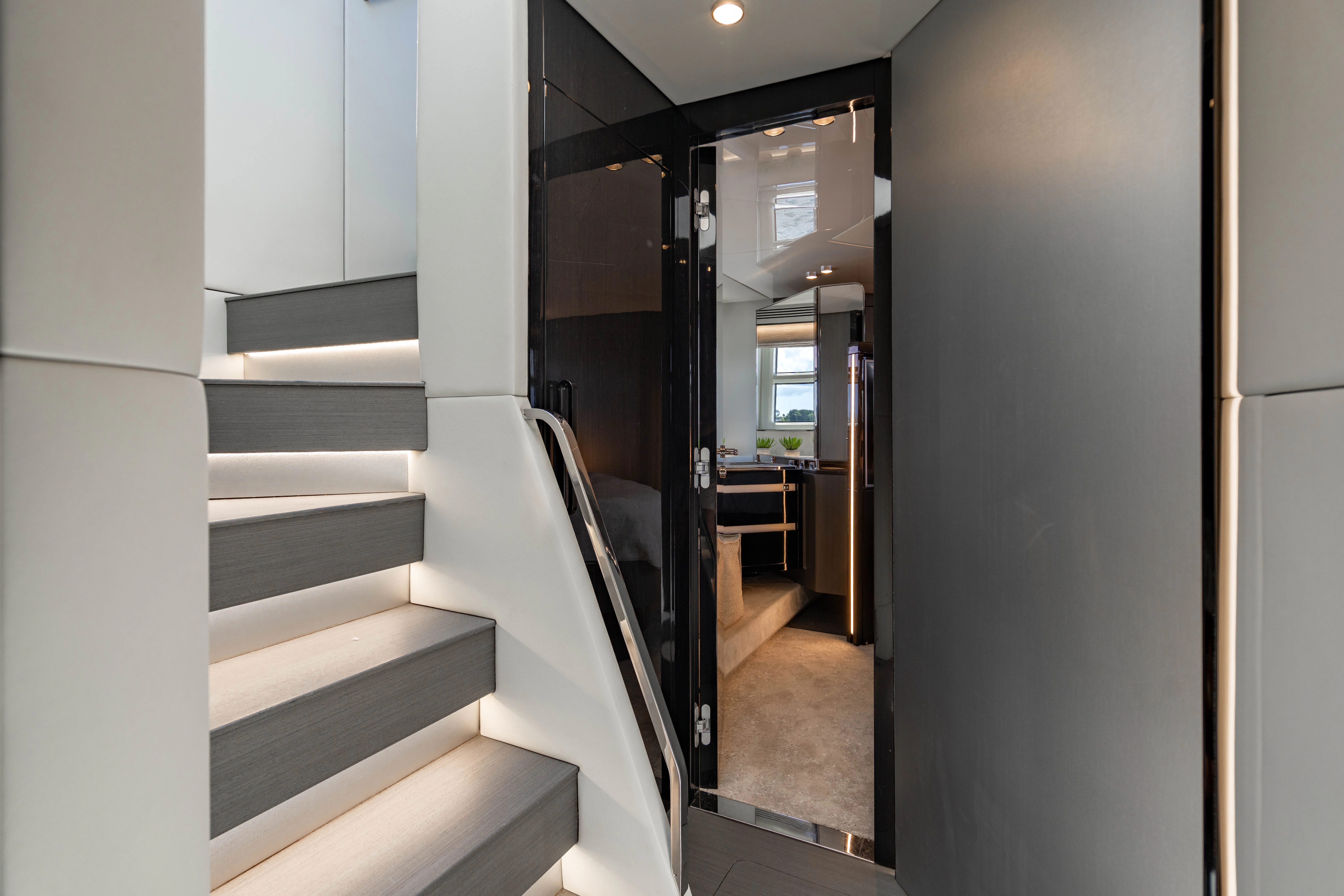 a hallway with white walls aboard ESCAPIST Yacht for Sale