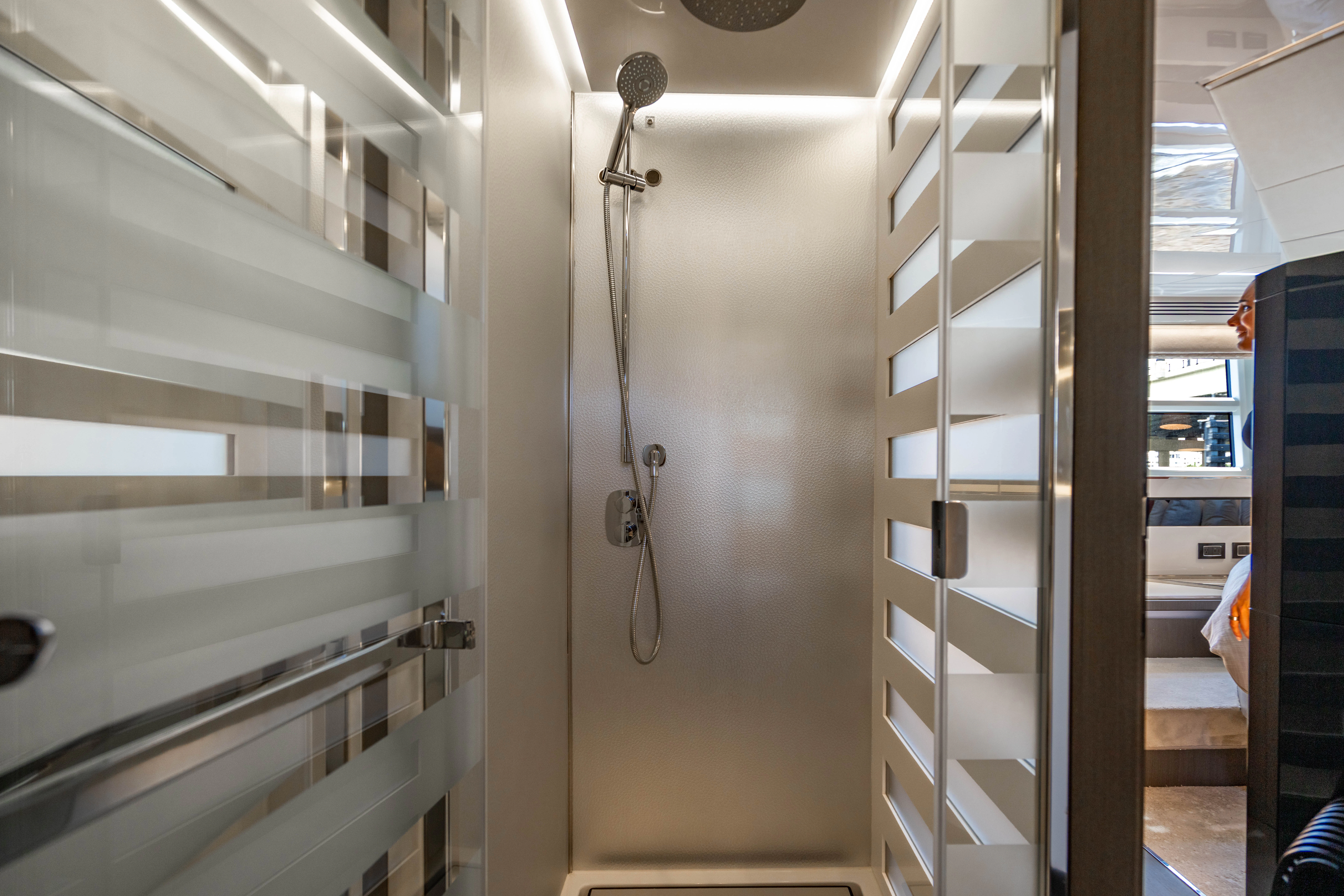 a hallway with white doors aboard ESCAPIST Yacht for Sale