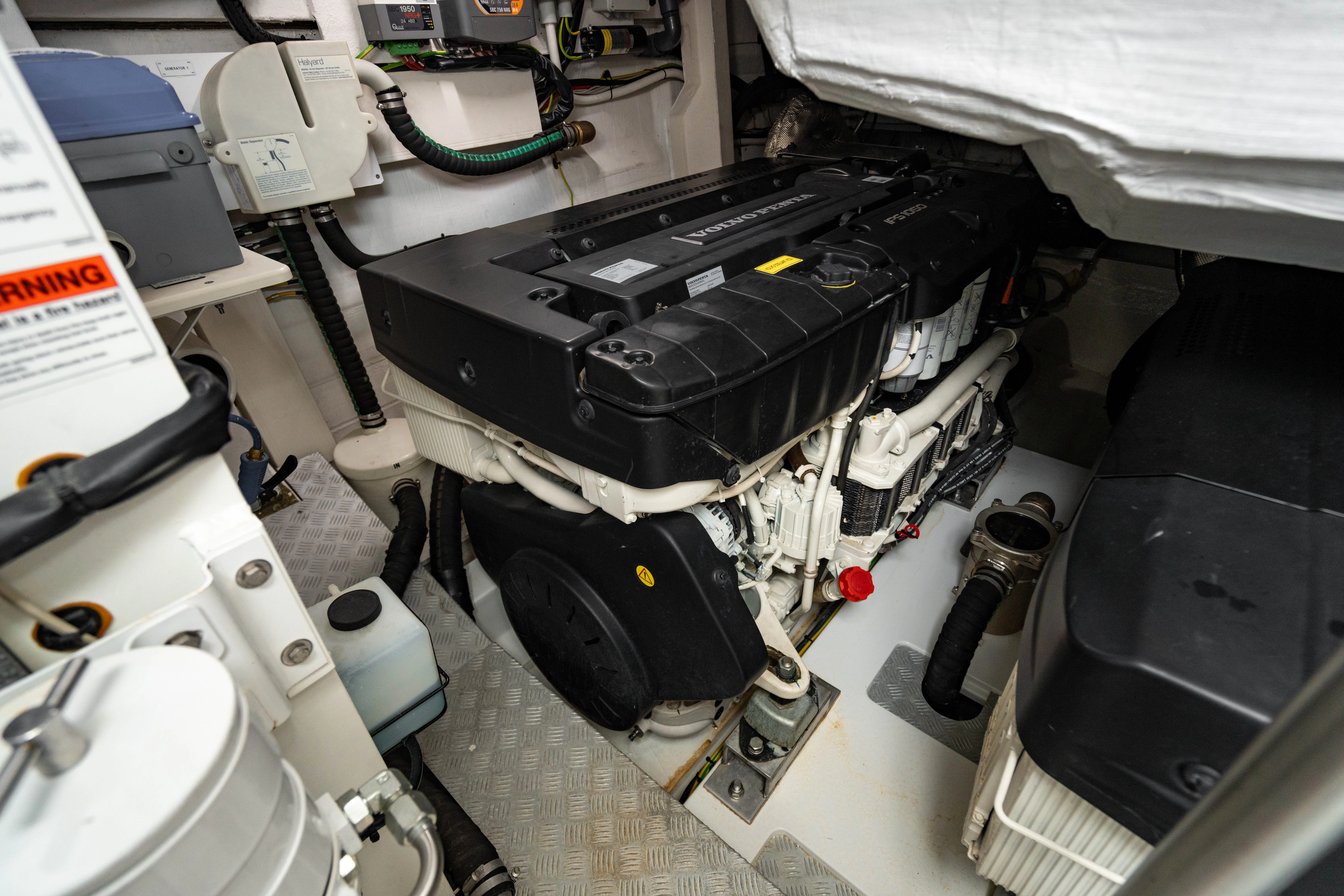 a car engine with a black hood aboard ESCAPIST Yacht for Sale