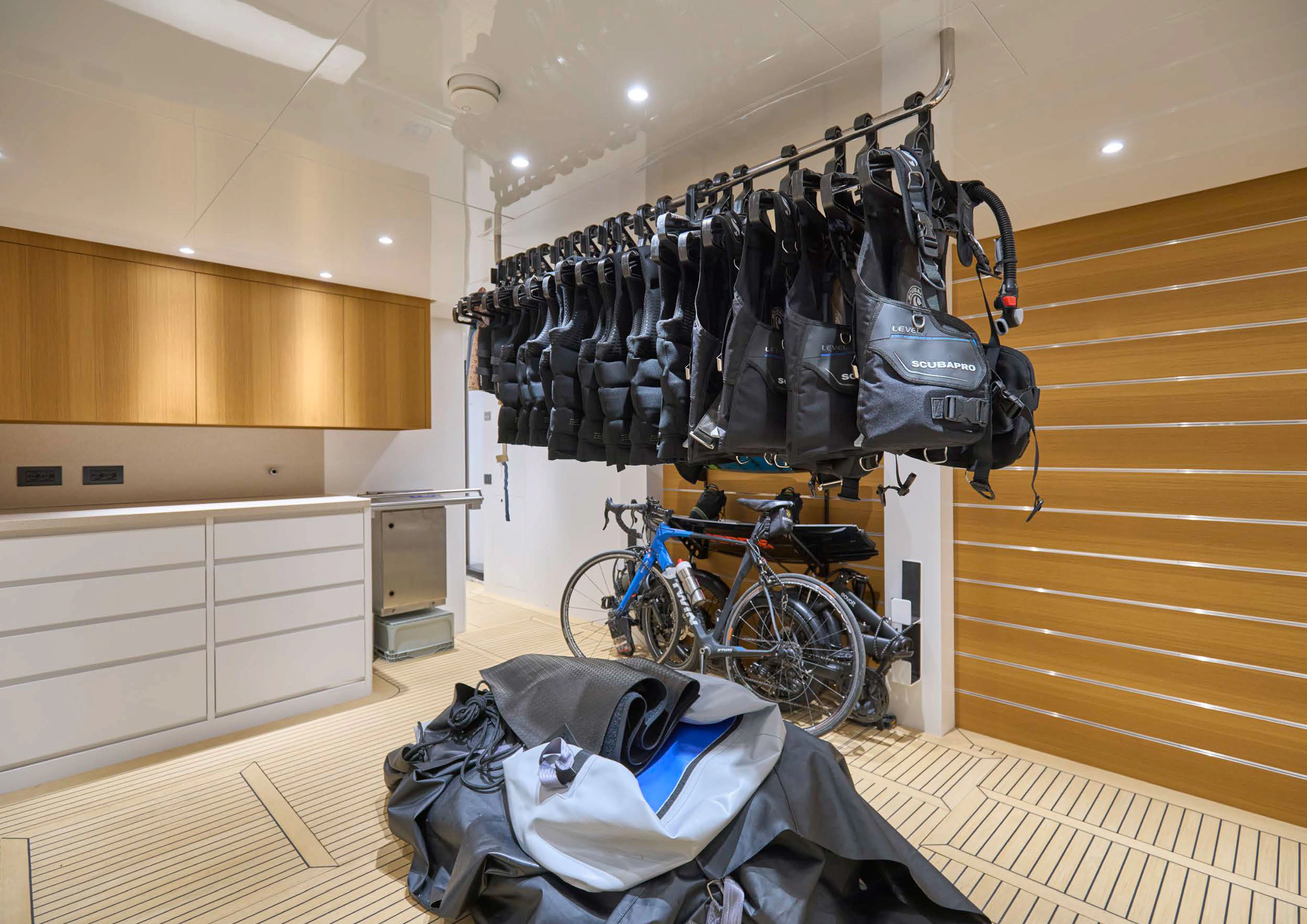 a bicycle and a backpack in a room aboard AWANDRA Yacht for Charter