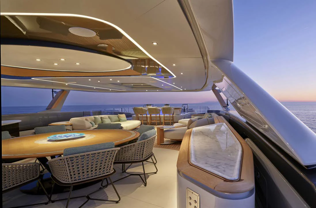 a boat with a table and chairs aboard AWANDRA Yacht for Charter