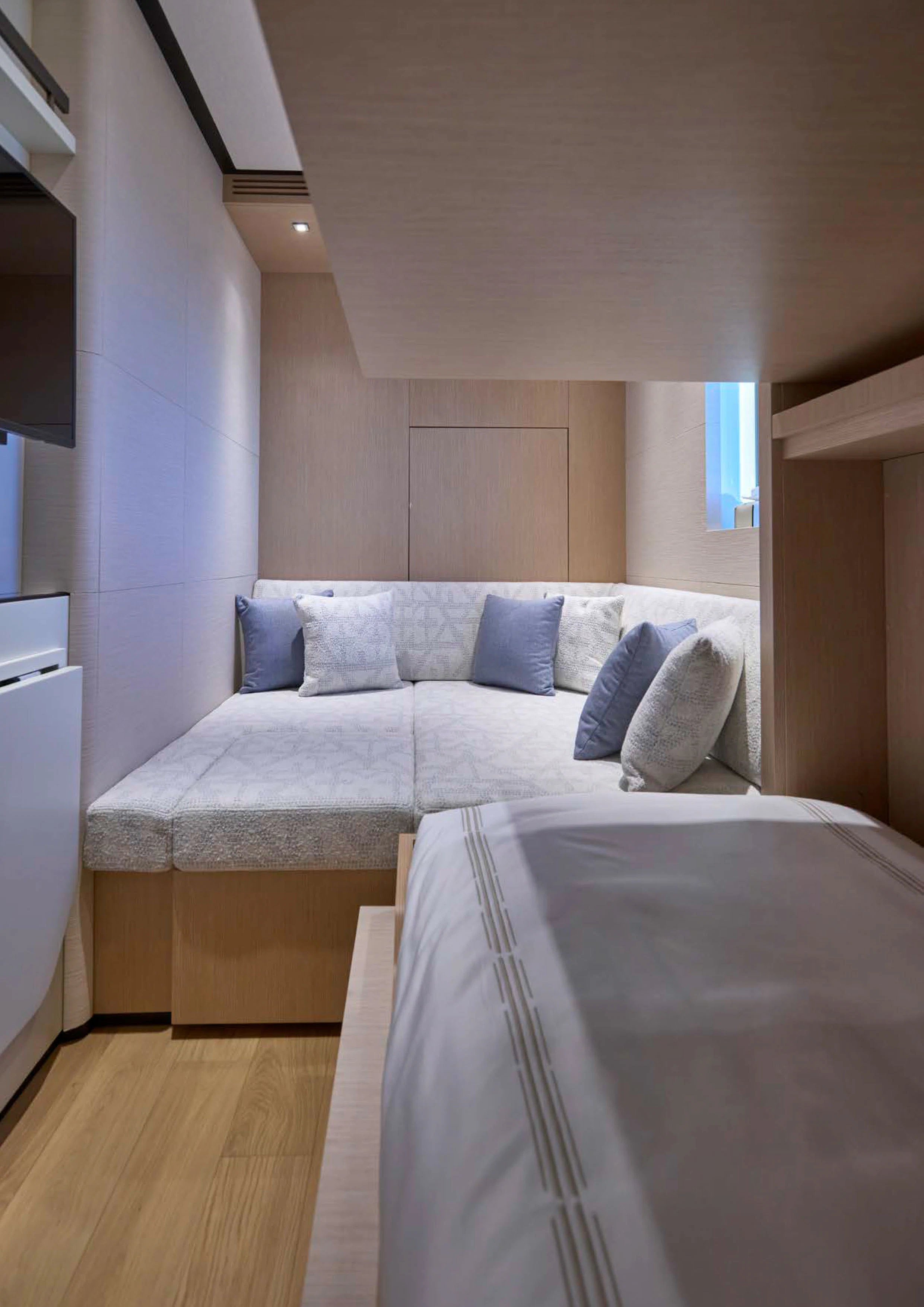 a bed with a white sheet aboard AWANDRA Yacht for Charter
