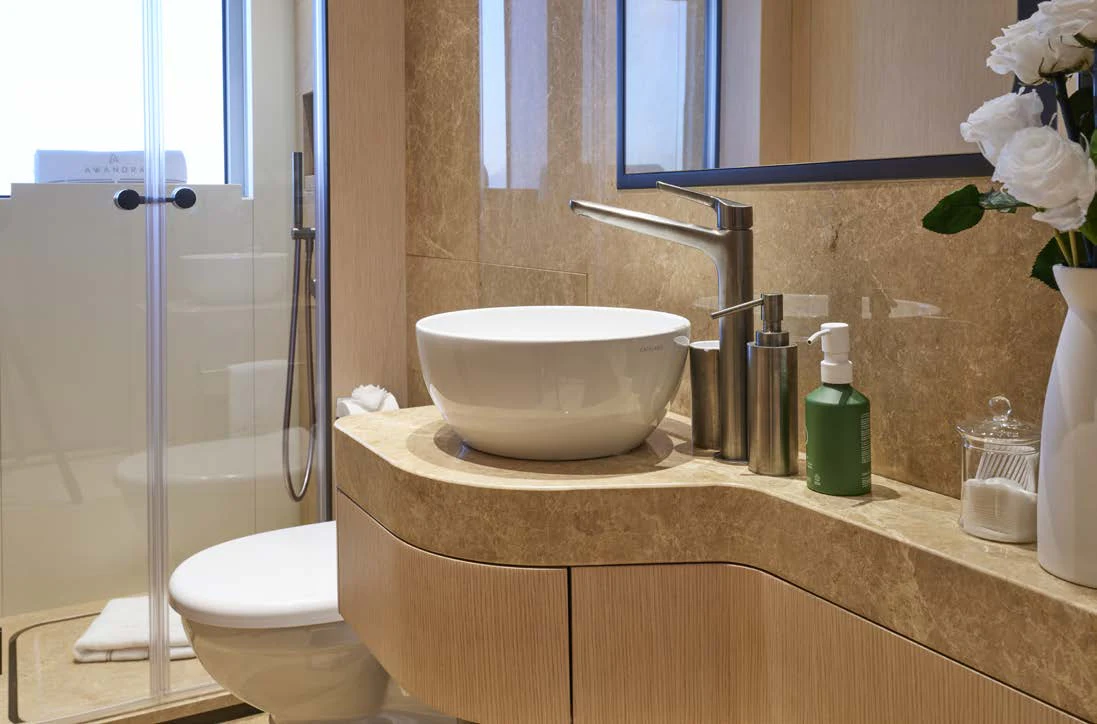 a bathroom with a sink toilet and a shower aboard AWANDRA Yacht for Charter