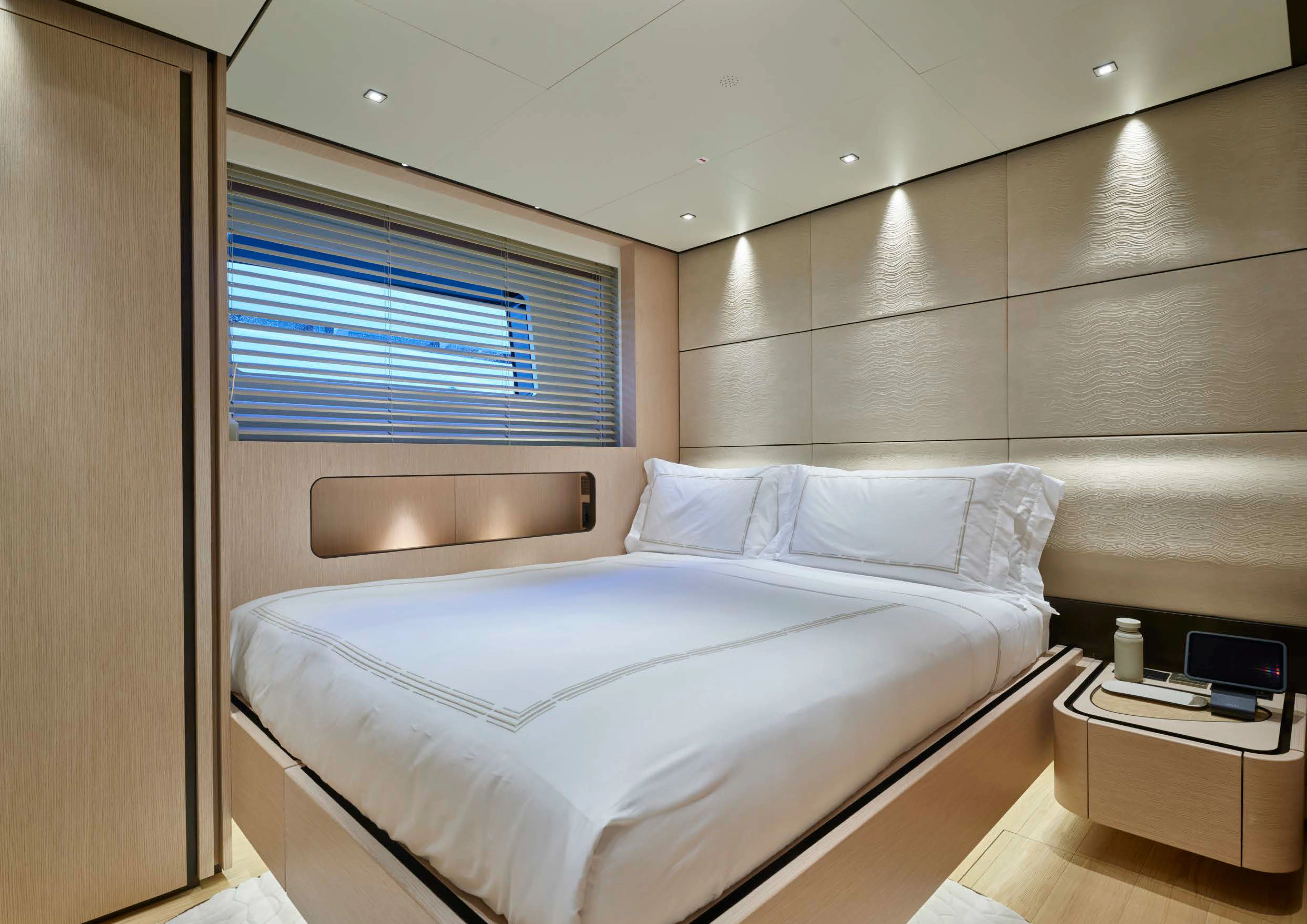 a room with a bed and a desk aboard AWANDRA Yacht for Charter