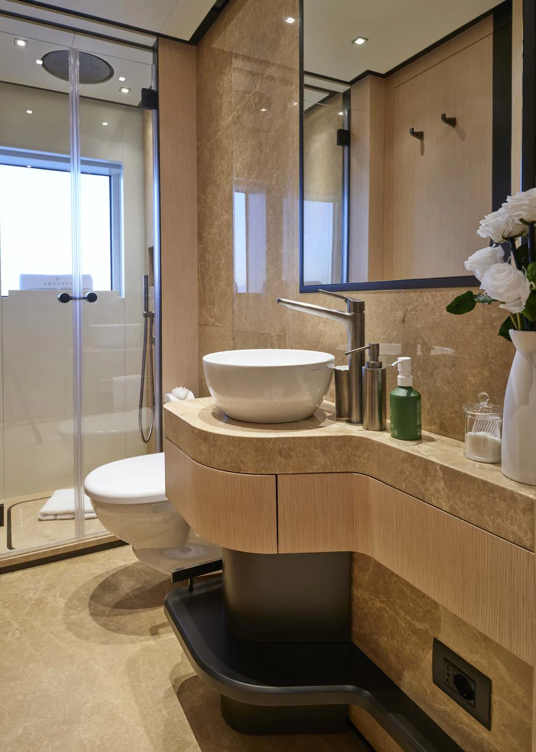 a bathroom with a large mirror aboard AWANDRA Yacht for Charter