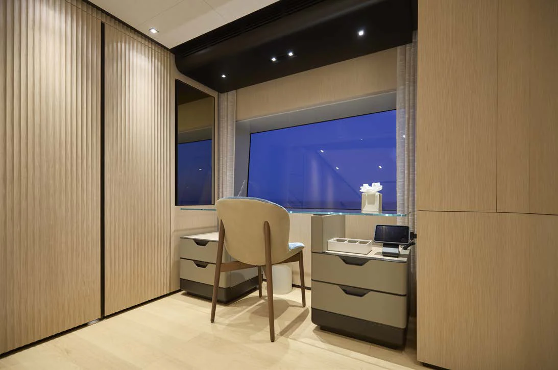 a room with a desk and a chair aboard AWANDRA Yacht for Charter